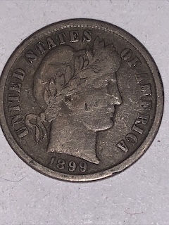 1899 Barber Dime off-center strike showing partial design and blank planchet area, approximately 20% off-center